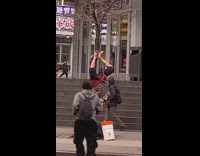 Guy hangs upside down tree trumpet bucket