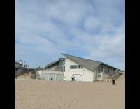 Black shirt girl white garage beach house 