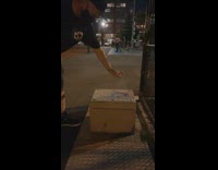 Guy sprays sanitizer lysol on black shoes 