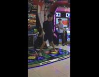 Guy dances on dance step arcade game 