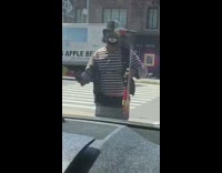 Striped shirt guy juggles red pins car