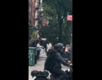 Man with Plastic Chair Stops Men to Fight