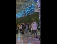 Man hoodie jacket blown horn at airport