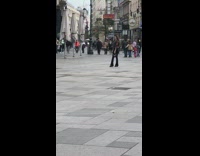 Woman black outfit bag stand park middle