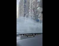 Car gets windshield frozen over by fire hydrant 