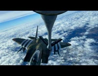 Jet plane refuels by another plane in mid-air