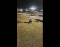 Guy jumps and falls off orange bicycle