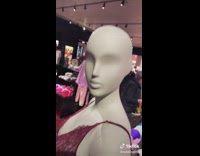 Guy grabs hand of mannequin