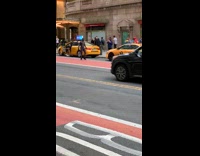 Spiderman runs and jumps over photographer 