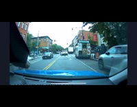 Dashcam footage of car swerving on stoplight
