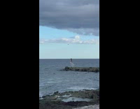 Girl white dress on beach jetty drone