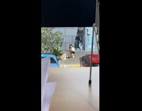 Woman promotes a product on the sidewalk