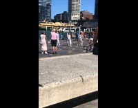 Group girls white clothes dance at wharf