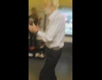 An old man dancing to violin music and Captain America in a subway from Buenos Aires