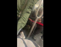 Guy with red guitar on subway
