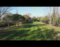 Guy hits golf ball drone follows grass