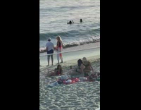 Girl pink bikini lay and pose sand beach