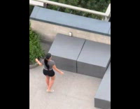 Collab IITW - Woman places phone and dances at balcony