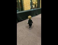 Little kid falls trying to support himself on table