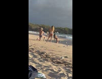 Woman bend over on sand do hair whip