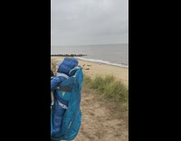 Mother carries child behind her takes selfie