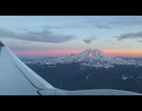 Plane pass by mountain snow on top