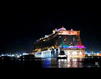 Cruise passengers flash lights to say goodbye