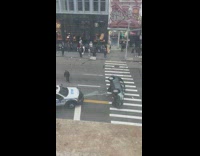 Car turned on side in middle of street