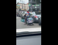 Collab WINY - Man has trolley tied on motorcycle 