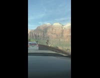 Woman shirt dance on ledge traffic mountain