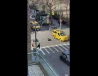 A man is seen laying in the middle of the street
