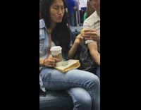 Woman bites pear and has disgusted face