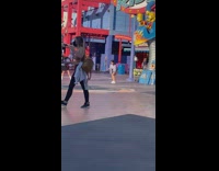 Woman promotes drink and then dance at the amusement park