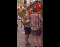 Man celebrates and poses with the number 30 balloon
