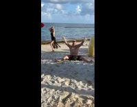 Man mock woman black dress photo shoot beach