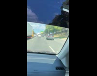 Collab WINY - Car drives with foot out on road