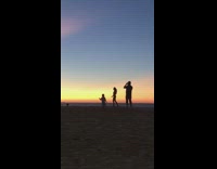 Dad films mom kid dance sunset silhouette