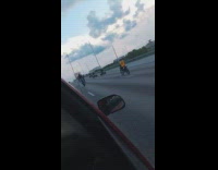 Guys ride dirt bike atv freeway highway 