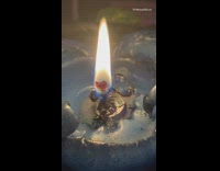 Blue candle burns fire flame birds chirp 