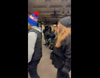 Man dances to woman singing at station