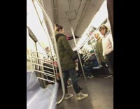 Four passengers stand still on subway train eyes closed