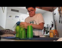 Guy times his cup stacking 