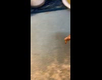 Guy picks up spoon, cup with chicken feet and eats it