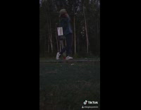 Brown hat guy hits golf ball woods