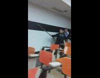 Two guys office chairs classroom jousting 
