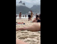 Woman green bikini tiktok dance at beach