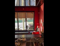 Man vlogs and eats food on the back of his car