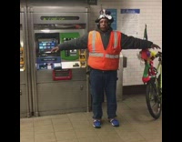 Man flaps his arms like a bird and makes bird noises in subway station