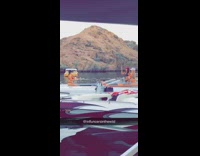 Girl bikini sit boat front lake mountain