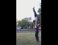 couple handstand woman falls head